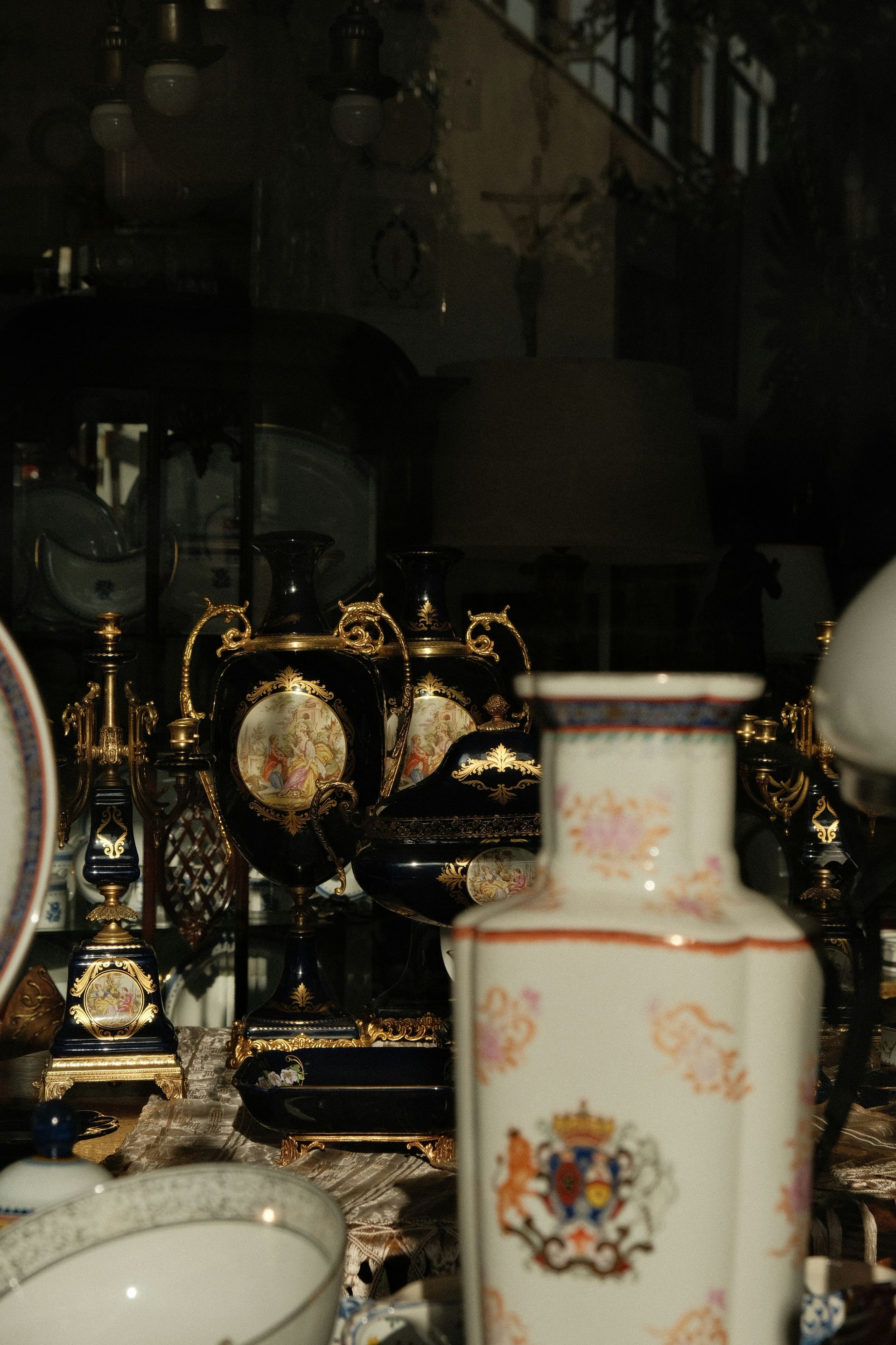 a table topped with lots of vases and plates